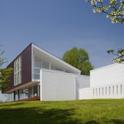 View of contemporary home. - View of contemporary architecture, corporate headquarters, cottage, daytime, elevation, facade, farmhouse, home, house, property, real estate, residential area, sky, brown