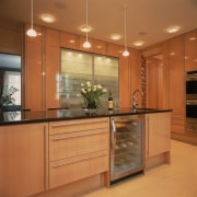View of remodeled kitchen in a Park Avenue cabinetry, countertop, cuisine classique, hardwood, interior design, kitchen, room, under cabinet lighting, orange, brown