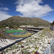 View of Remarkables Primary School in Queenstown. - leisure, mountain, real estate, resort, resort town, sky, swimming pool, tourism, water, gray