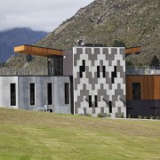 View of Remarkables Primary School in Queenstown. - architecture, building, elevation, facade, home, house, property, real estate, sky, gray