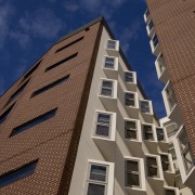 View of the Boston University student accommodation in angle, apartment, architecture, brick, building, commercial building, condominium, daytime, elevation, facade, home, house, metropolis, metropolitan area, neighbourhood, real estate, residential area, roof, sky, skyscraper, tower block, urban area, wall, window, brown