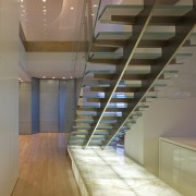 View of penthouse with white walls and a architecture, ceiling, daylighting, floor, flooring, glass, handrail, hardwood, interior design, laminate flooring, lobby, stairs, wall, wood, wood flooring, brown