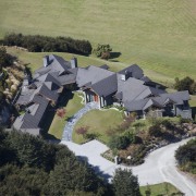 High angle shot of contemporary hilltop home. - aerial photography, bird's eye view, cottage, estate, home, house, landscape, photography, property, real estate, rural area, suburb, village, black