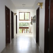 View of contemporary home with light-toned walls and architecture, ceiling, daylighting, floor, flooring, hardwood, home, house, interior design, property, real estate, room, window, gray, black