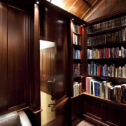 View of wooden floor, ceiling, walls and bookshelf. bookcase, cabinetry, furniture, interior design, shelving, red