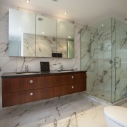 View of bathroom with marble-patterened porcelain tiles and bathroom, bathroom accessory, bathroom cabinet, cabinetry, ceiling, countertop, estate, floor, flooring, home, interior design, property, room, sink, tile, wall, gray