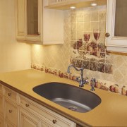 View of undermounted double sinks by Artisan Manufacturing bathroom, cabinetry, countertop, floor, flooring, home, interior design, kitchen, property, room, sink, tile, under cabinet lighting, orange