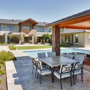 View of contemporary home with outdoor seating area backyard, estate, hacienda, home, house, leisure, patio, property, real estate, resort, swimming pool, villa, gray