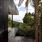 Designed by Chris Tate of Chris Tate Architecture, architecture, cottage, home, house, outdoor structure, real estate, tree, walkway, wood, black, brown