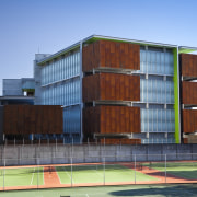 View of the Mt Eden Corrections Facility. - apartment, architecture, building, commercial building, condominium, corporate headquarters, elevation, facade, home, house, mixed use, real estate, residential area, teal