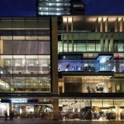 Exterior night shot of 420 George Street, featuring building, facade, mixed use, night, brown, black