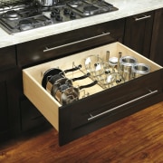 View of kitchen organisation products by Rev-A-Shelf, including countertop, drawer, furniture, gas stove, home appliance, kitchen, kitchen appliance, kitchen stove, table, black