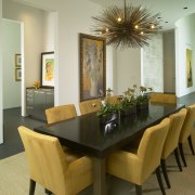 View of dining table with yellow chairs. - dining room, furniture, interior design, living room, property, real estate, room, table, brown