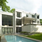 View of white home and pool. - View architecture, building, condominium, corporate headquarters, elevation, estate, facade, home, house, property, real estate, residential area, window, white, green