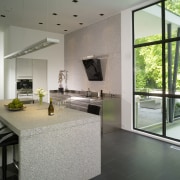 View of white kitchen. - View of white architecture, estate, floor, flooring, house, interior design, living room, property, real estate, window, gray