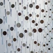 A heritage coin collection is encased in custom-designed design, material, pattern, gray
