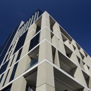 View of cladding by Unicast Cladding Systems. - angle, architecture, brutalist architecture, building, commercial building, condominium, corporate headquarters, daytime, facade, headquarters, landmark, line, metropolis, metropolitan area, mixed use, sky, skyscraper, structure, tower block, urban area, blue, gray