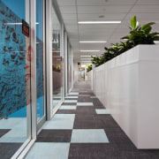 View of contemporary carpet tiles with checkerboard design. architecture, daylighting, floor, flooring, house, real estate, gray