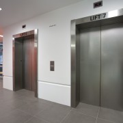 View of steel features at Mt Eden prison door, elevator, floor, flooring, lobby, property, real estate, gray