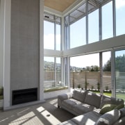 VIew of lounge area in contemporary home. - architecture, ceiling, daylighting, floor, house, interior design, living room, real estate, window, window covering, window treatment, gray