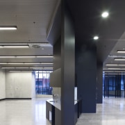 View of the Anvil Building, with angled custom architecture, ceiling, daylighting, floor, interior design, lobby, black, gray