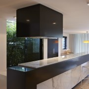 The kitchen designed by Michael Kilkeary features ventilation architecture, cabinetry, countertop, interior design, kitchen, real estate, black, gray