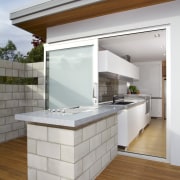 This kitchen features stainless steel benchtops. It was architecture, countertop, house, interior design, kitchen, real estate, gray