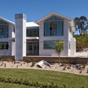 View of Jalcon home with landscaped garden. - architecture, building, cottage, elevation, estate, facade, home, house, mansion, property, real estate, residential area, villa, window, brown