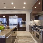 View of contemporary kitchen with dark toned cabinets. cabinetry, ceiling, countertop, interior design, kitchen, real estate, gray, brown