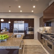 View of contemporary kitchen with dark toned cabinets. cabinetry, countertop, cuisine classique, estate, interior design, kitchen, property, real estate, brown