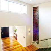 Contemporary home. Oppidan Homes. Director Steven Gild.  architecture, ceiling, daylighting, floor, flooring, hardwood, home, house, interior design, laminate flooring, lighting, living room, loft, real estate, room, stairs, wall, window, wood, wood flooring, white