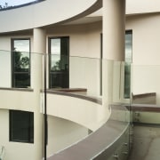 View of home with curved, toughened glass balustrade. architecture, glass, interior design, white