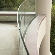 View of home with curved, toughened glass balustrade. architecture, glass, handrail, stairs, gray, brown