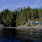 View of waterfront home. - View of waterfront bank, bay, boat, body of water, coast, cottage, cove, fjord, house, inlet, lake, lake district, landscape, loch, mountain, nature, plant, reflection, reservoir, river, sea, shore, sky, tree, water, waterway, wilderness, black, blue