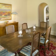 Floors stained rich dark mahogany.  Dining area. chair, dining room, furniture, home, interior design, living room, property, real estate, room, table, brown, orange