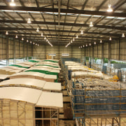 View of building by Hutchinson Builders. - View structure, brown