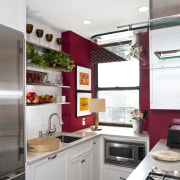 Black porcelain floor tiles. Red accenting walls. Carra cabinetry, countertop, home appliance, interior design, kitchen, room, white