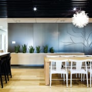 Natural materials are used throughout the design. Oak ceiling, dining room, furniture, interior design, table