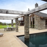 This is a pool landscape designed by Mark backyard, estate, house, outdoor structure, patio, property, real estate, gray