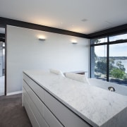 The master bed in this modern master suite apartment, architecture, estate, house, interior design, property, real estate, room, window, gray