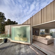 This house was designed by Andy MacDonald with architecture, daylighting, facade, home, house, real estate, wood, gray, teal