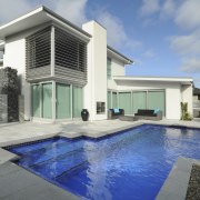 A new pool, by Mayfair pools, featuring a architecture, elevation, estate, facade, home, house, property, real estate, swimming pool, villa, window, gray