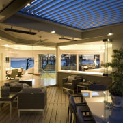 Graeme Alexander Homes. Lifestyle Residence. Angled wall planes. ceiling, daylighting, interior design, lighting, living room, real estate, brown