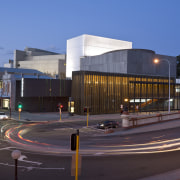 This is the Perth State Theatre, designed by architecture, building, city, commercial building, corporate headquarters, downtown, metropolis, metropolitan area, mixed use, real estate, residential area, sky, blue, black