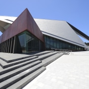 View of the exterior of the Albany Entertainment architecture, building, daylighting, facade, house, roof, sky, structure, white, teal