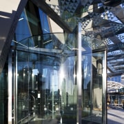 View of the entrance of the Novotel Auckland architecture, building, facade, glass, metropolitan area, structure, black, blue