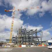 Novotel Auckland Airport by Gorge Grant Engineering. cloud, construction, construction equipment, crane, sky, gray