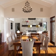 This home was designed by Peter Chibnall of ceiling, dining room, hardwood, interior design, kitchen, living room, real estate, room, table, window, wood flooring, gray