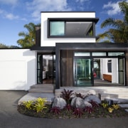 This new house was designed by Richard Furze architecture, elevation, facade, home, house, property, real estate, window, black