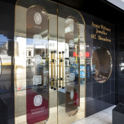 View of the Anna Webster Jeweler boutique.Features repeating display window, glass, interior design, retail, window, black, gray